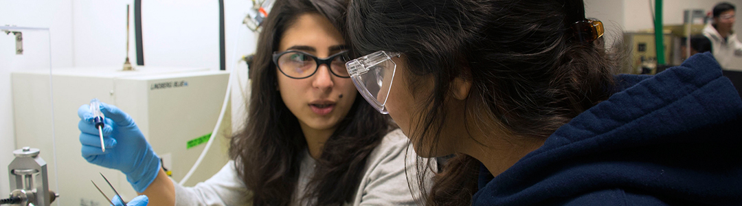 two female students working in chemical engineering lab