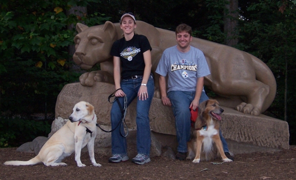 Fulllerton and her husband with two dogs at the lion shrine