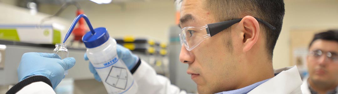 male student working in chemical engineering lab