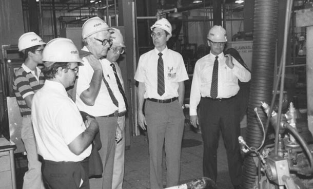 a group of men in a lab facility