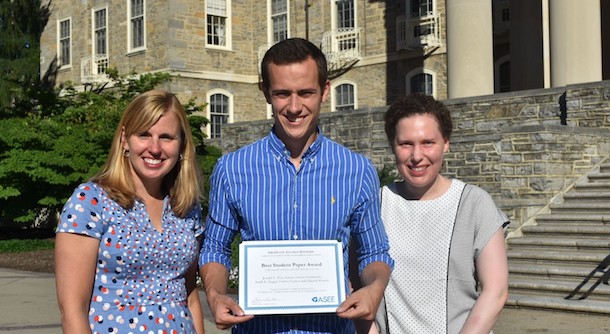 Sarah Zappe, Joseph Tise and Kristen Hochstedt with award outside Old Main