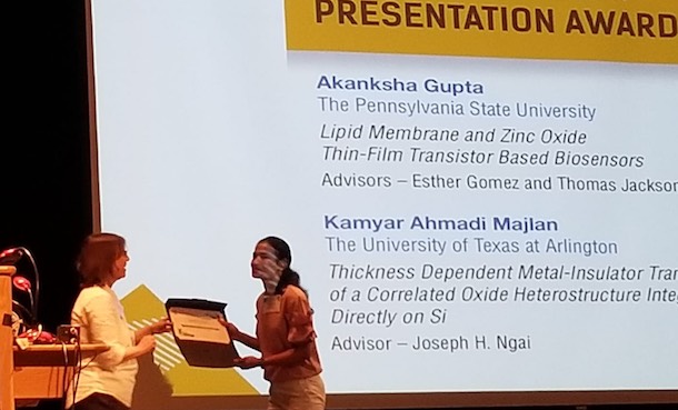 Akanksha Gupta receiving award on stage at event