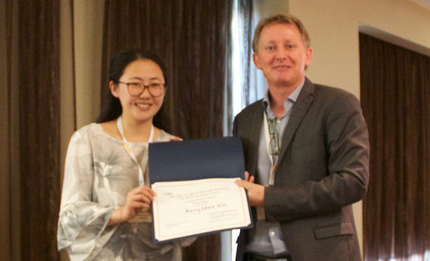 Hongshen Liu receiving award from Pierre Lucas