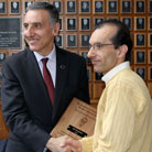 Ali Borhan receiving the Lawrence J. Perez Memorial Student Advocate Award from Dean Amr Elnashai.